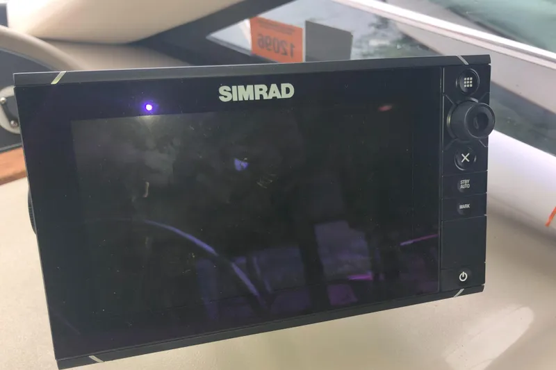 Slide: The Image of Simrad navigation system on 1997 Bayliner 3988 Motor Yacht dashboard. - 27