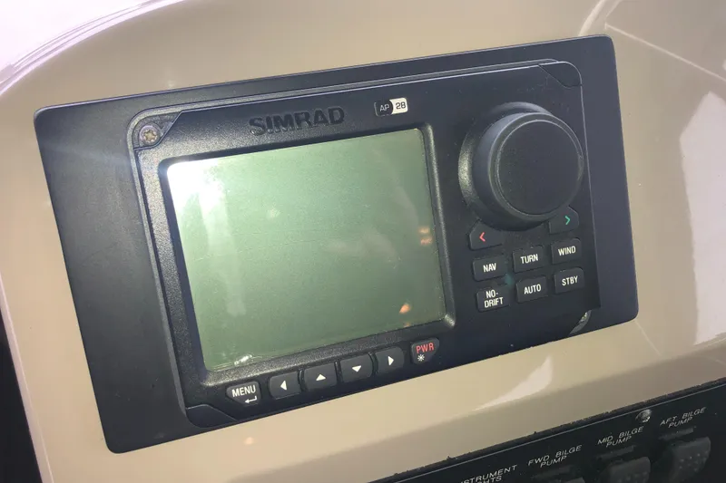 Slide: The Image of Simrad navigation system on 1997 Bayliner 3988 Motor Yacht dashboard. - 29