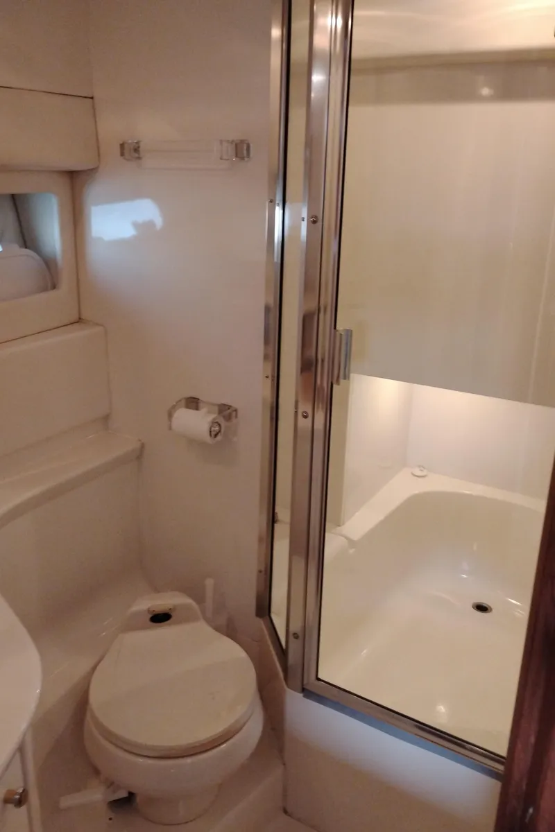 Slide: The Image of Bathroom interior of 1997 Bayliner 3988 Motor Yacht with shower and toilet. - 34