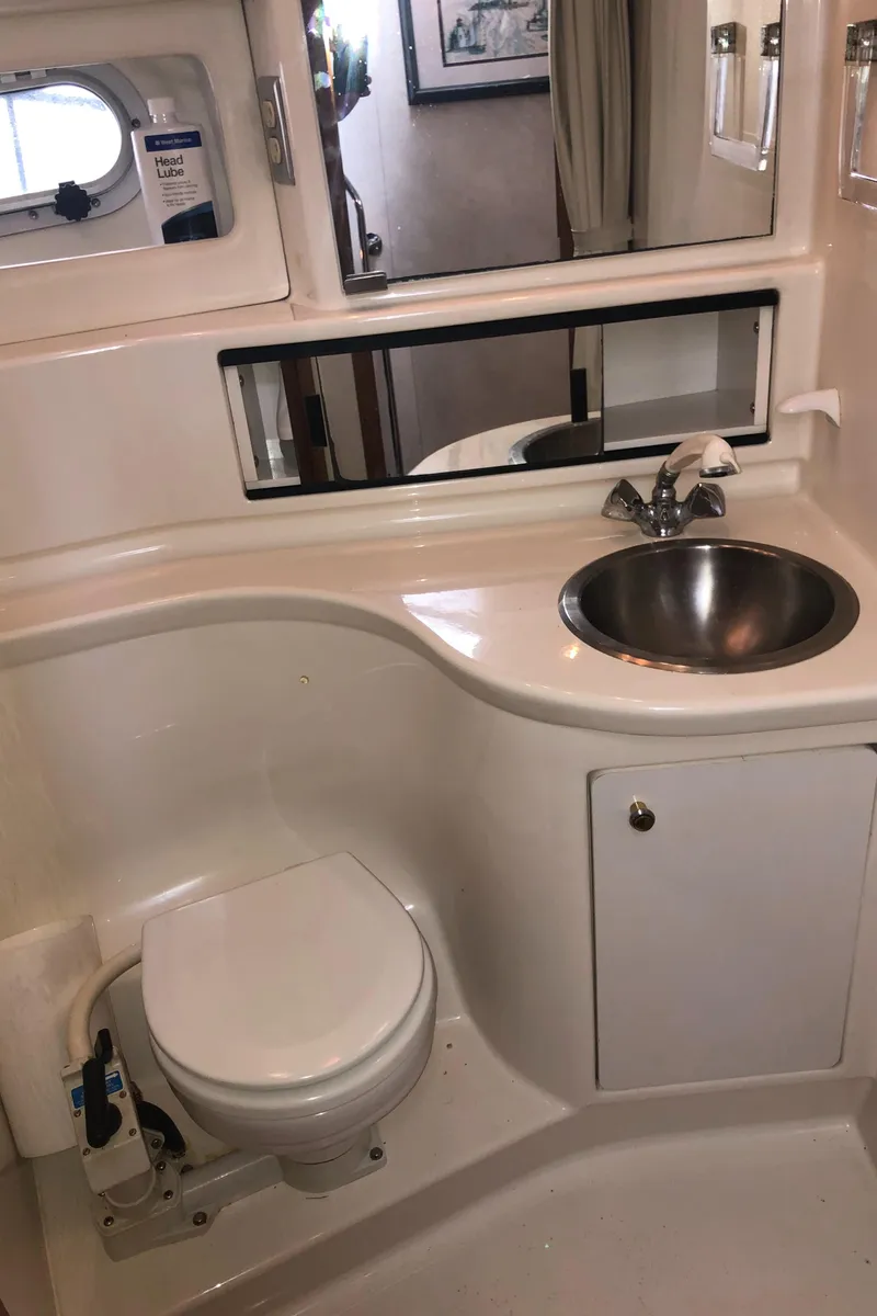 Slide: The Image of Bathroom interior of 1997 Bayliner 3988 Motor Yacht with sink and toilet. - 39