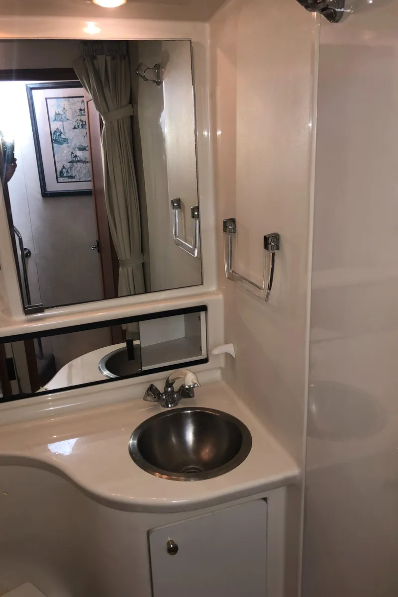 Slide: The Image of Bathroom interior of 1997 Bayliner 3988 Motor Yacht with sink and mirror. - 40