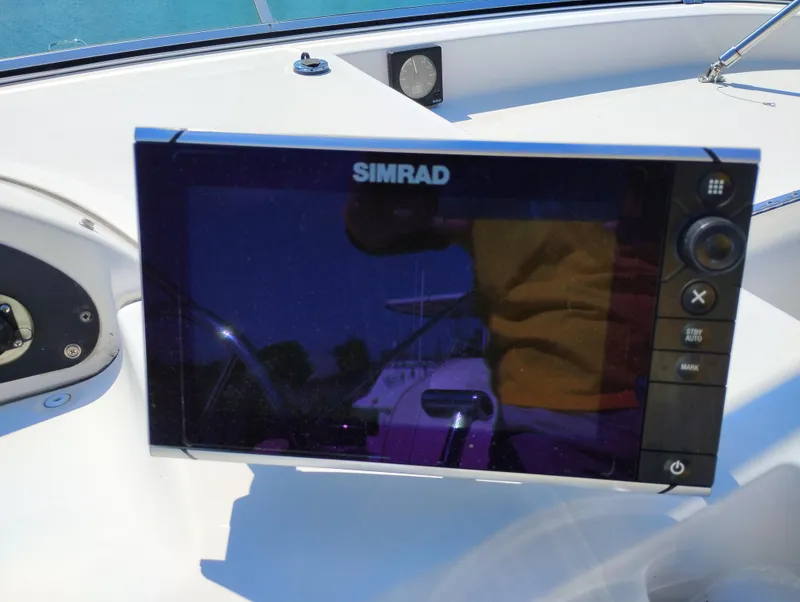 Slide: The Image of Simrad navigation system on 1997 Bayliner 3988 Motor Yacht dashboard. - 7