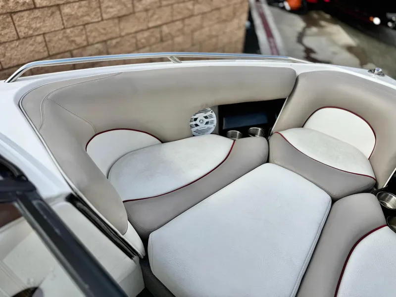 Slide: The Image of 2007 Malibu Wakesetter 247 LSV boat interior with white and beige seating. - 10