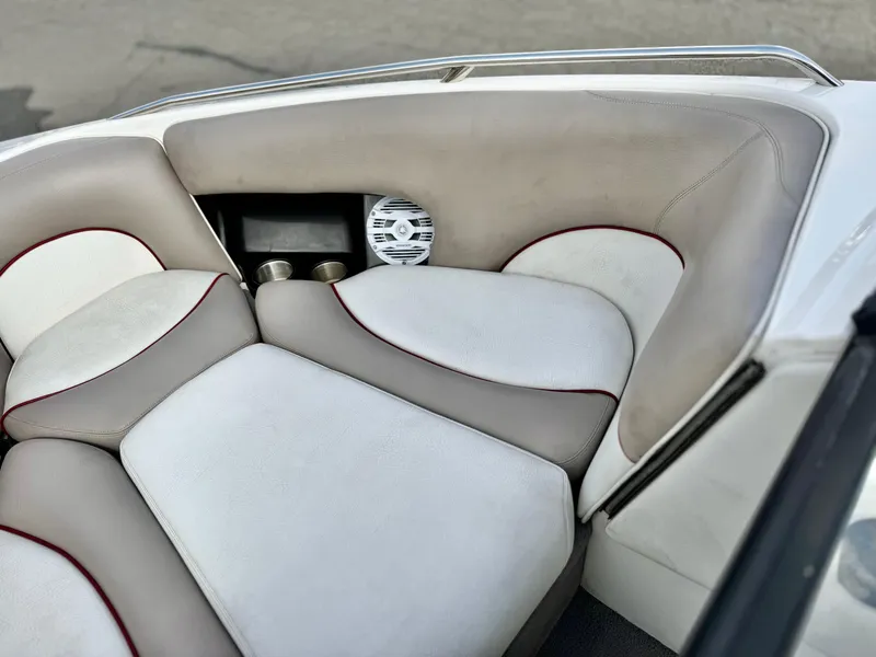 Slide: The Image of 2007 Malibu Wakesetter 247 LSV interior with cushioned seating and speaker system. - 11