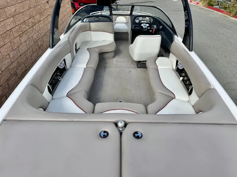 Slide: The Image of 2007 Malibu Wakesetter 247 LSV boat interior with spacious seating and modern dashboard. - 12