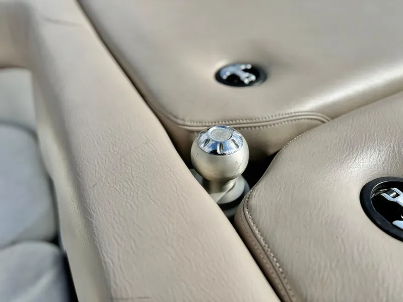 Slide: The Image of 2007 Malibu Wakesetter 247 LSV interior detail with beige upholstery and metal fixtures. - 13