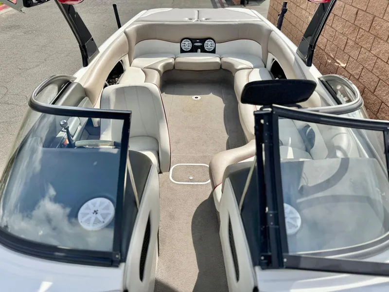 Slide: The Image of 2007 Malibu Wakesetter 247 LSV interior with open windshield and seating. - 14