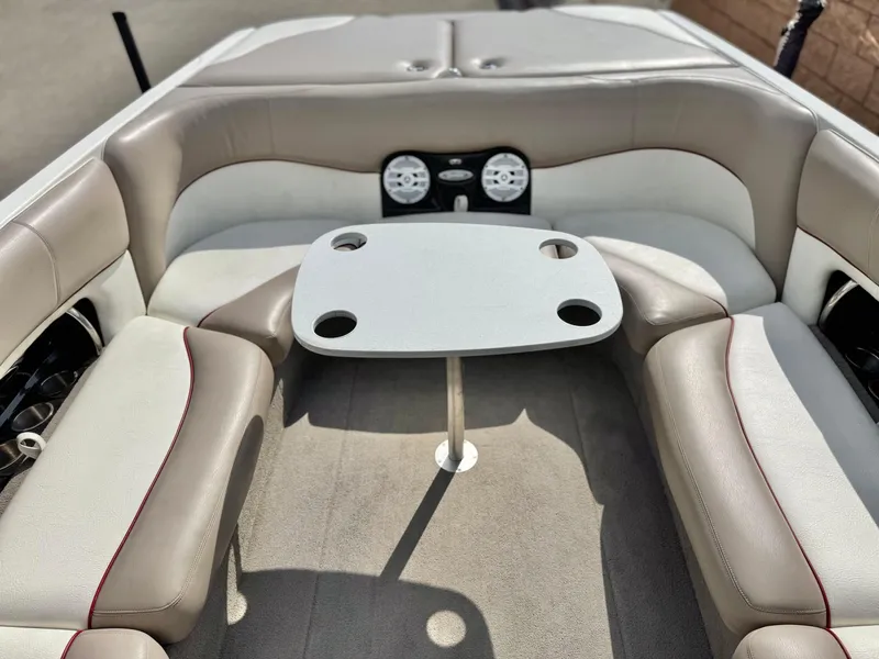Slide: The Image of 2007 Malibu Wakesetter 247 LSV interior with seating and table setup. - 15
