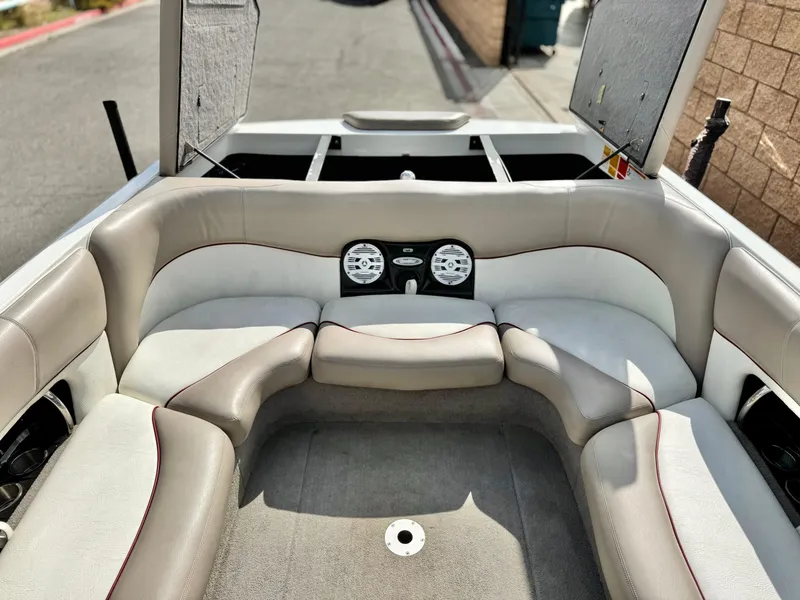 Slide: The Image of 2007 Malibu Wakesetter 247 LSV boat interior with open storage compartments. - 17