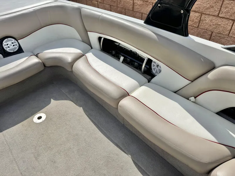 Slide: The Image of 2007 Malibu Wakesetter 247 LSV interior with gray seating and speaker system. - 26