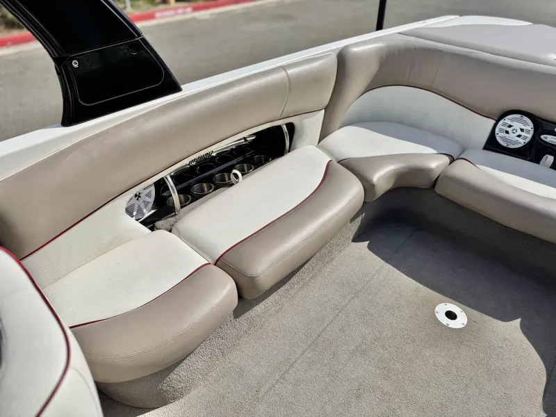 Slide: The Image of 2007 Malibu Wakesetter 247 LSV interior with beige seating and dashboard details. - 27