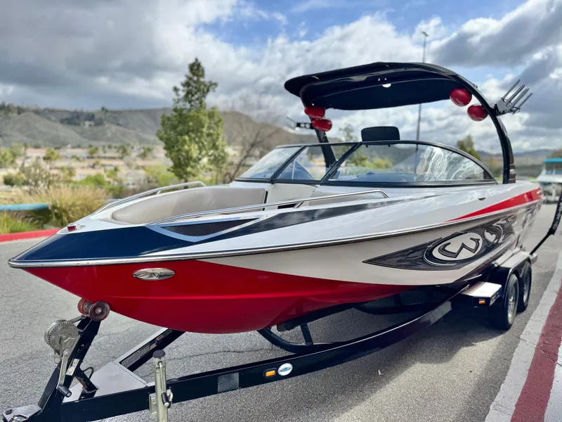 Slide: The Image of 2007 Malibu Wakesetter 247 LSV boat on trailer, parked outdoors. - 3