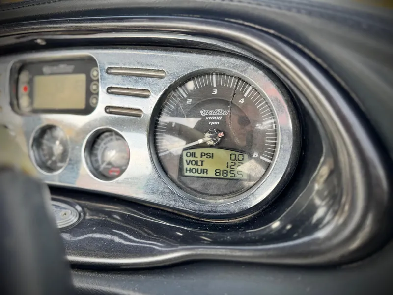 Slide: The Image of Dashboard of a 2007 Malibu Wakesetter 247 LSV boat showing gauges and digital display. - 33