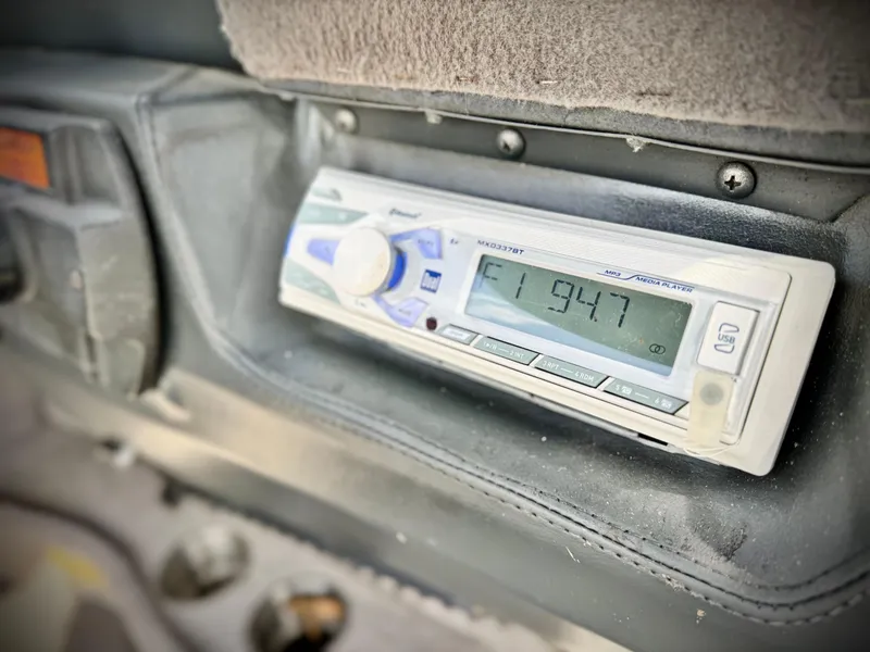 Slide: The Image of 2007 Malibu Wakesetter 247 LSV dashboard with Pioneer radio displaying FM 94.7. - 34