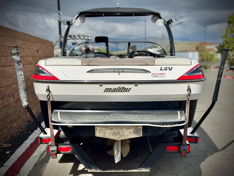 Slide: The Image of 2007 Malibu Wakesetter 247 LSV boat rear view with wakeboard racks. - 4
