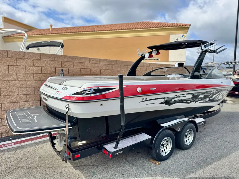 Slide: The Image of 2007 Malibu Wakesetter 247 LSV boat on trailer, parked outdoors. - 5