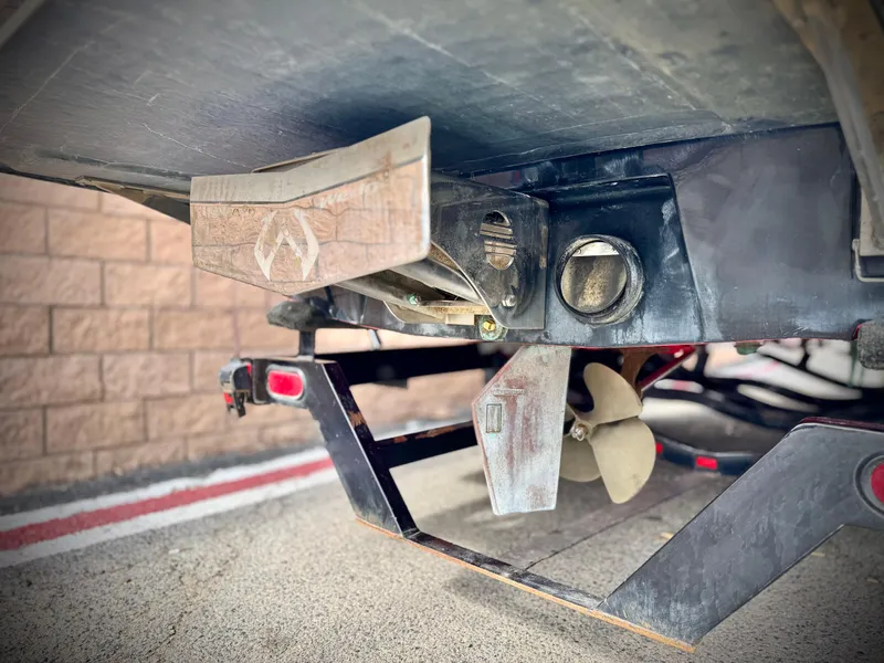 Slide: The Image of 2007 Malibu Wakesetter 247 LSV boat underside showing propeller and rudder components. - 7