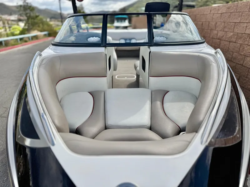 Slide: The Image of 2007 Malibu Wakesetter 247 LSV boat interior with plush seating and open bow design. - 8
