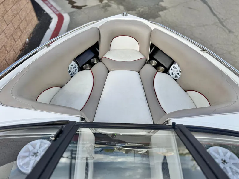 Slide: The Image of 2007 Malibu Wakesetter 247 LSV boat interior with cushioned seating and speakers. - 9