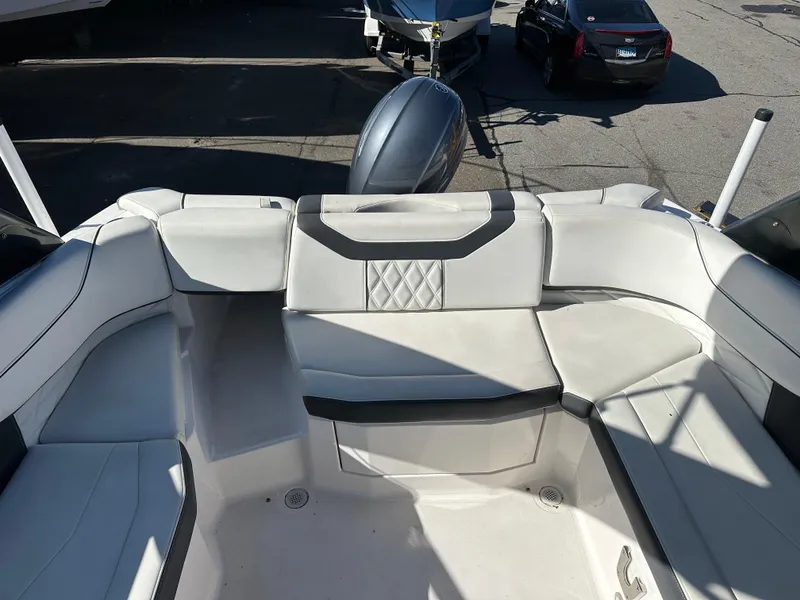Slide: The Image of 2018 Regal 23 OBX boat interior with white seating and black accents. - 10