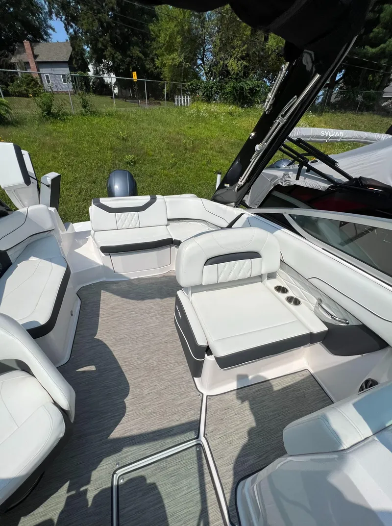 Slide: The Image of 2018 Regal 23 OBX boat interior with white seating and modern design. - 18