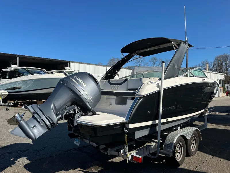 Slide: The Image of 2018 Regal 23 OBX boat with Yamaha outboard motor on a trailer. - 4
