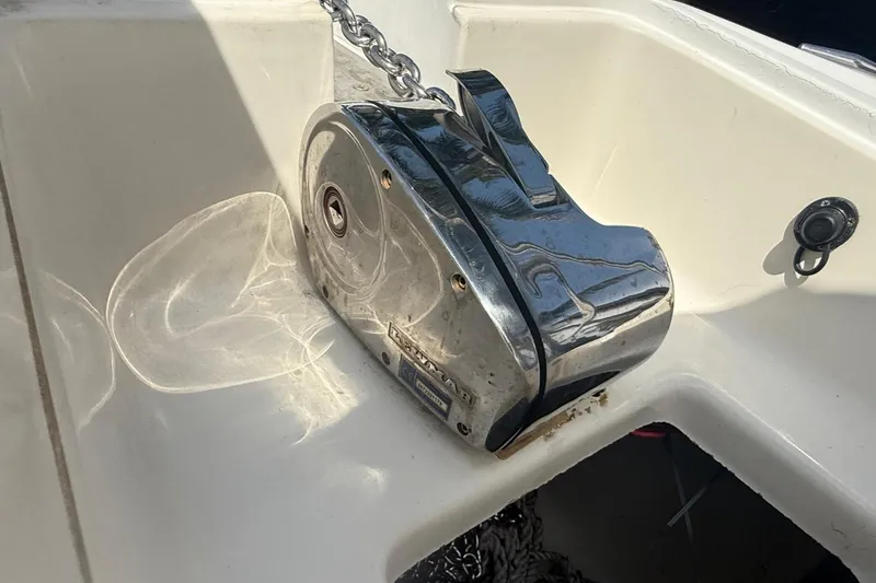 Slide: The Image of Anchor winch on 1999 Boston Whaler 28 Conquest boat, reflecting sunlight. - 10