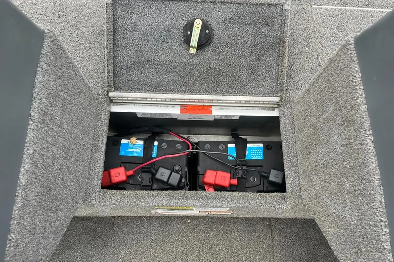 Slide: The Image of 2010 Alumacraft Navigator 175 CS boat battery compartment with dual batteries. - 20