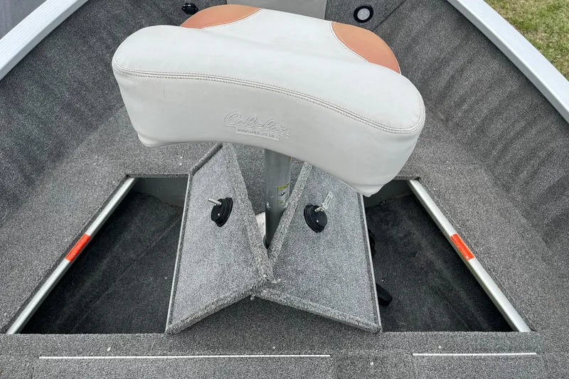 Slide: The Image of 2010 Alumacraft Navigator 175 CS boat interior with storage compartments and cushioned seat. - 22