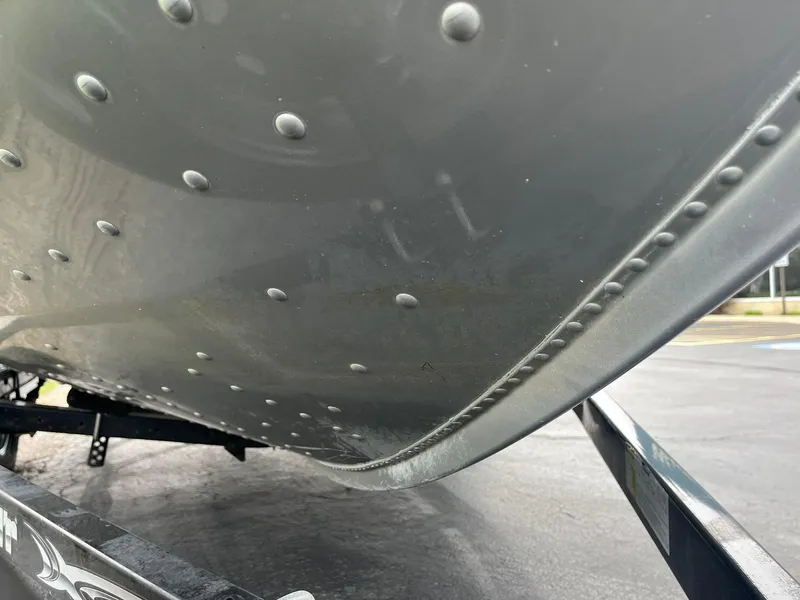 Slide: The Image of 2010 Alumacraft Navigator 175 CS boat hull with rivets, viewed from below. - 30