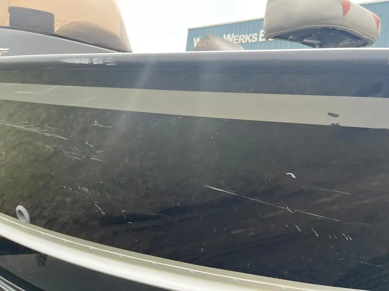 Slide: The Image of 2010 Alumacraft Navigator 175 CS boat with visible scratches on the side. - 34