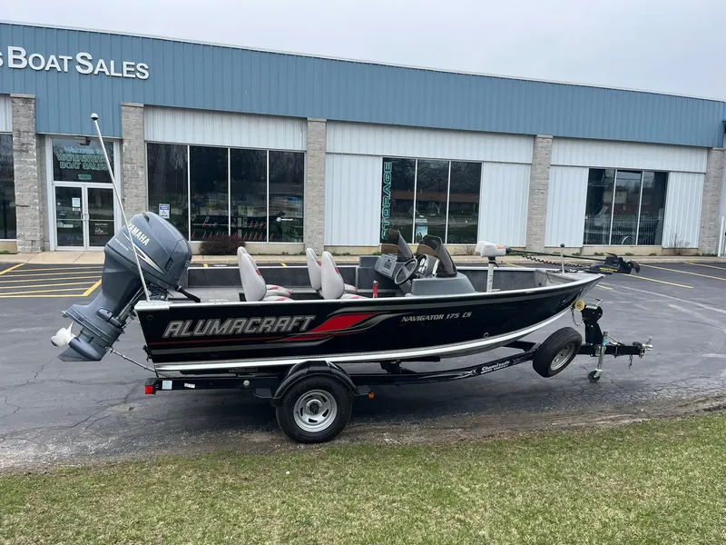 Slide: The Image of 2010 Alumacraft Navigator 175 CS boat on trailer outside dealership. - 4