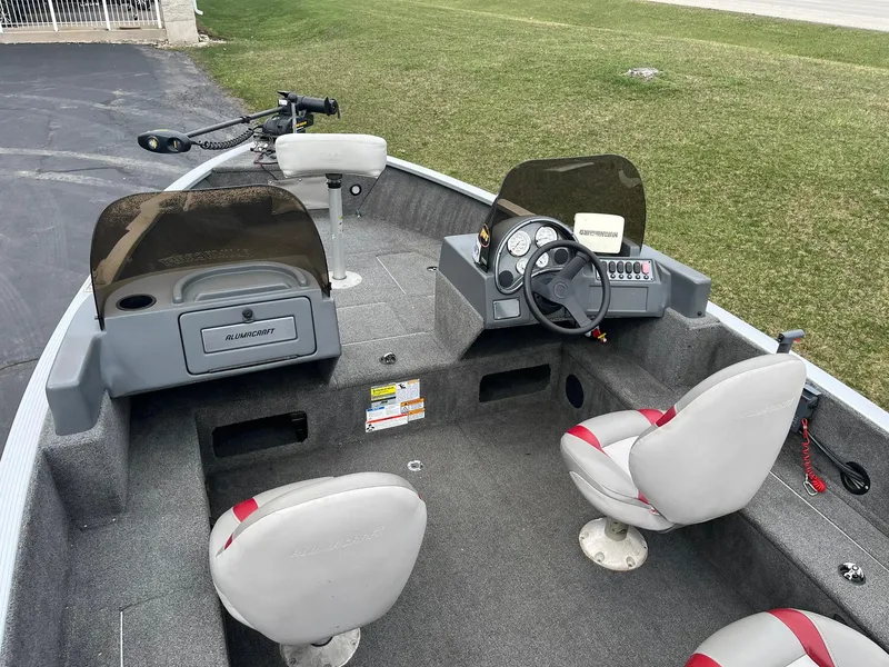 Slide: The Image of 2010 Alumacraft Navigator 175 CS boat interior with steering console and seating. - 7