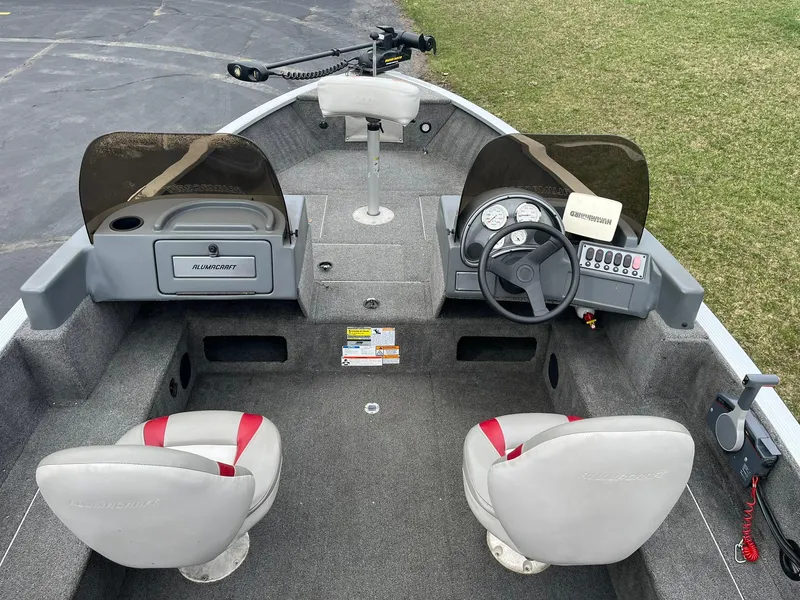 Slide: The Image of 2010 Alumacraft Navigator 175 CS boat interior with dual seats and steering console. - 8