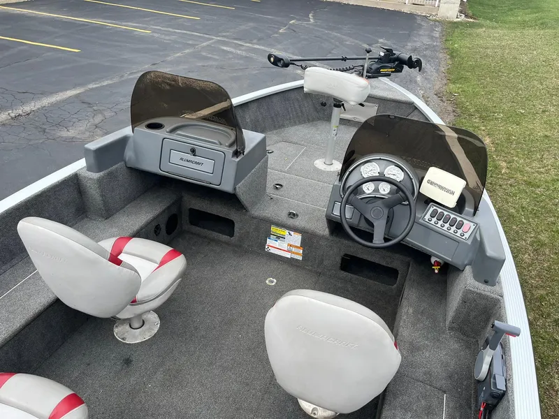 Slide: The Image of 2010 Alumacraft Navigator 175 CS boat interior with seating and control panel. - 9