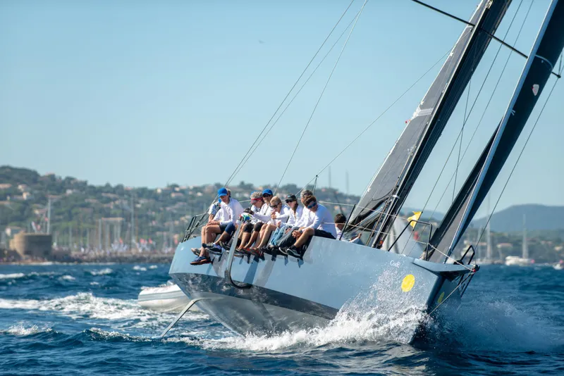 Slide: The Image of Sailing yacht Black Pepper CODE 1, 2025 model, with crew navigating ocean waters. - 5