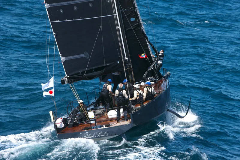 Slide: The Image of Sailing yacht "Black Pepper CODE 1" navigating ocean waves, 2025 model. - 8