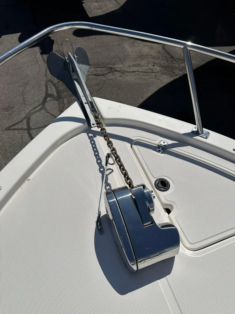 Slide: The Image of 1998 Pursuit 2460 Denali boat anchor and chain on deck. - 8