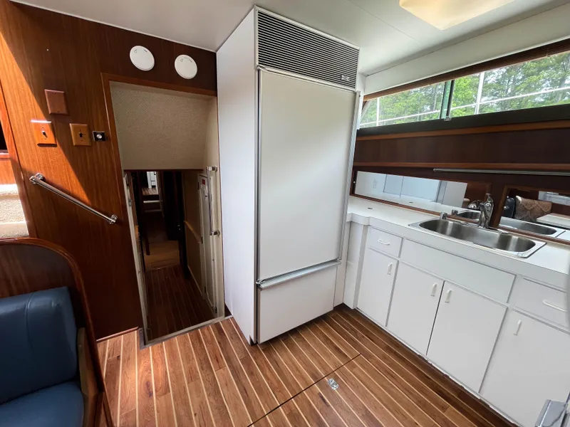 Slide: The Image of Interior of 1984 Hatteras 53 Motoryacht with wood flooring and white cabinetry. - 23