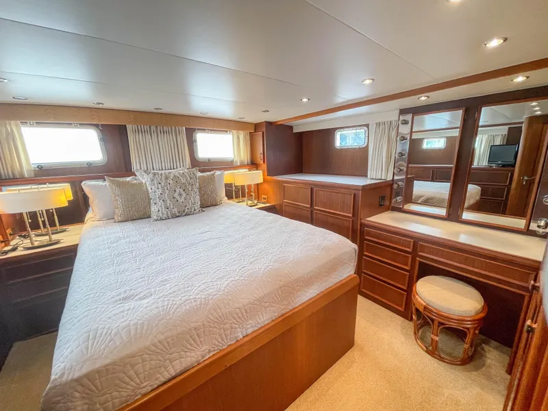 Slide: The Image of Luxurious bedroom interior of 1984 Hatteras 53 Motoryacht with elegant wood furnishings. - 35