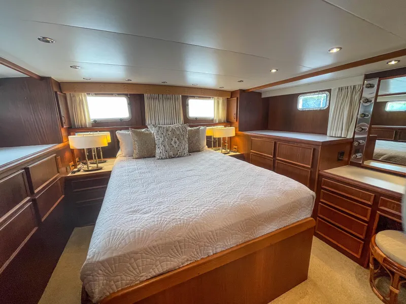 Slide: The Image of Luxurious bedroom interior of 1984 Hatteras 53 Motoryacht with elegant wood furnishings. - 45