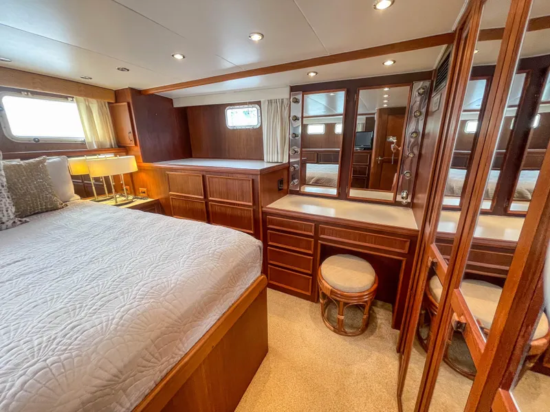 Slide: The Image of Luxurious cabin interior of 1984 Hatteras 53 Motoryacht with elegant wood furnishings. - 47