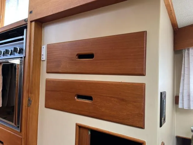 Slide: The Image of Wooden cabinetry inside 1981 Grand Banks 36 Classic boat, featuring sleek, minimalist design. - 14