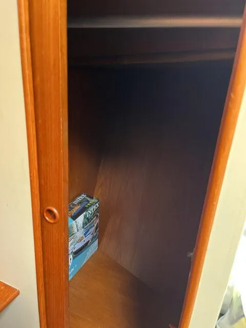 Slide: The Image of Wooden closet interior on 1981 Grand Banks 36 Classic boat. - 15