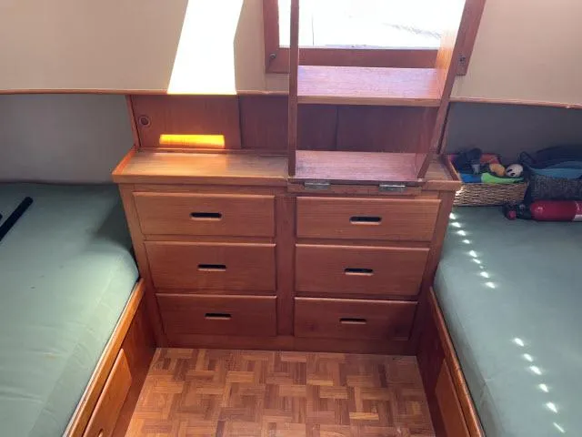 Slide: The Image of 1981 Grand Banks 36 Classic cabin with wooden drawers and parquet flooring. - 24