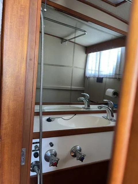 Slide: The Image of Bathroom interior of 1981 Grand Banks 36 Classic yacht with sink and mirror. - 26