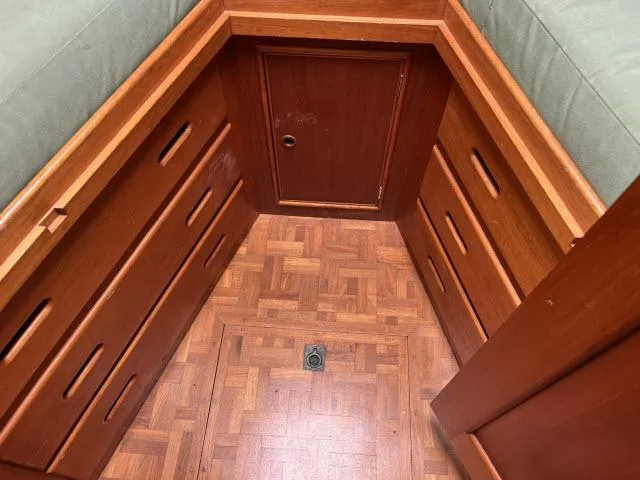 Slide: The Image of Wooden interior of 1981 Grand Banks 36 Classic boat with parquet flooring and storage drawers. - 28