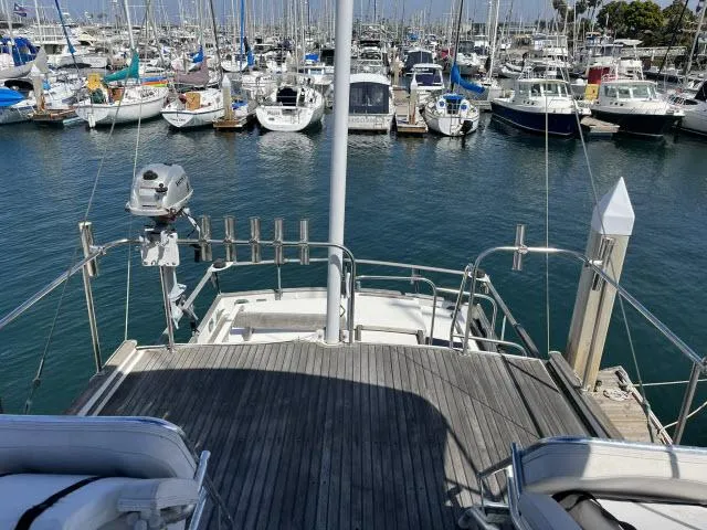 Slide: The Image of 1981 Grand Banks 36 Classic yacht docked in a marina, surrounded by various boats. - 40