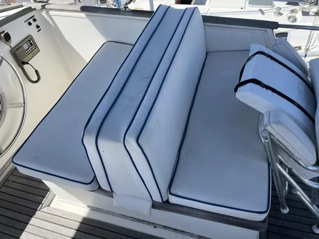 Slide: The Image of 1981 Grand Banks 36 Classic boat seating with white cushions and blue trim. - 42