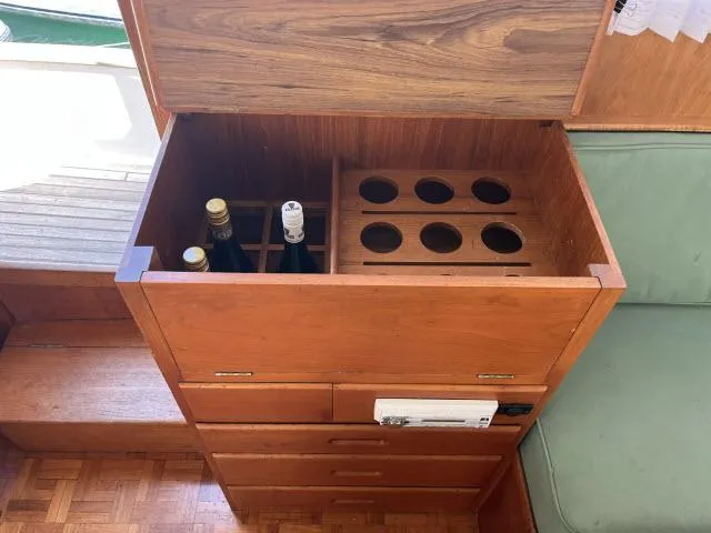 Slide: The Image of Wooden storage cabinet with wine rack on 1981 Grand Banks 36 Classic boat. - 5